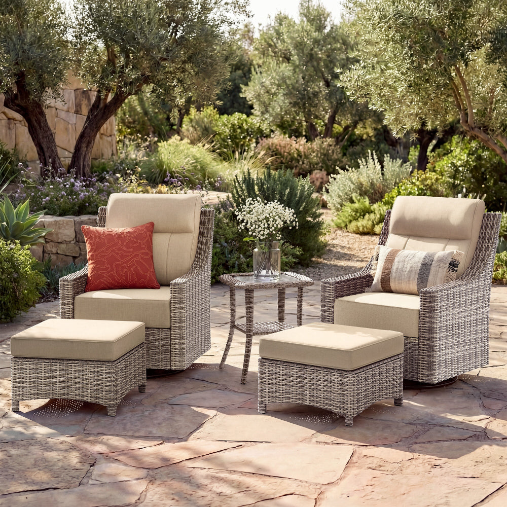 Outdoor patio set with chairs, ottomans, and a table in a garden setting.