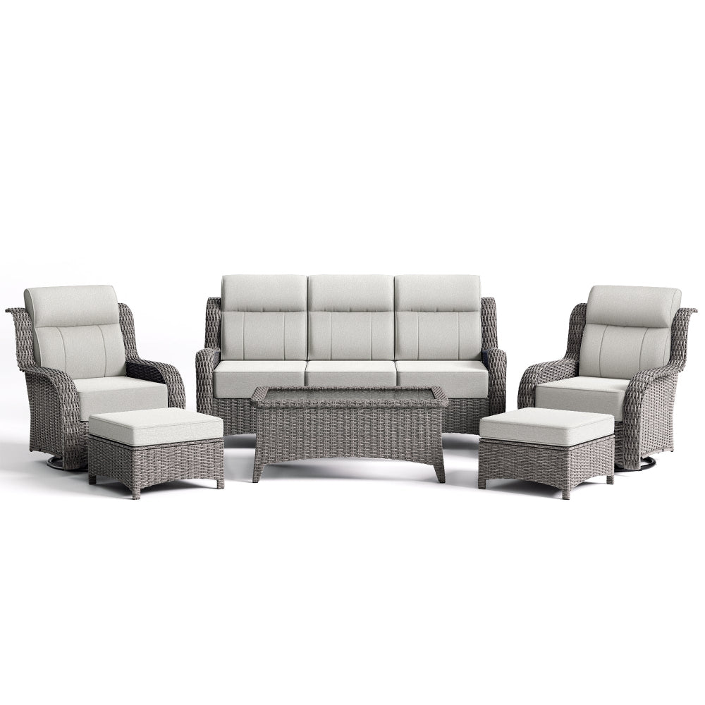 Outdoor furniture set with gray wicker frames and white cushions on a white background