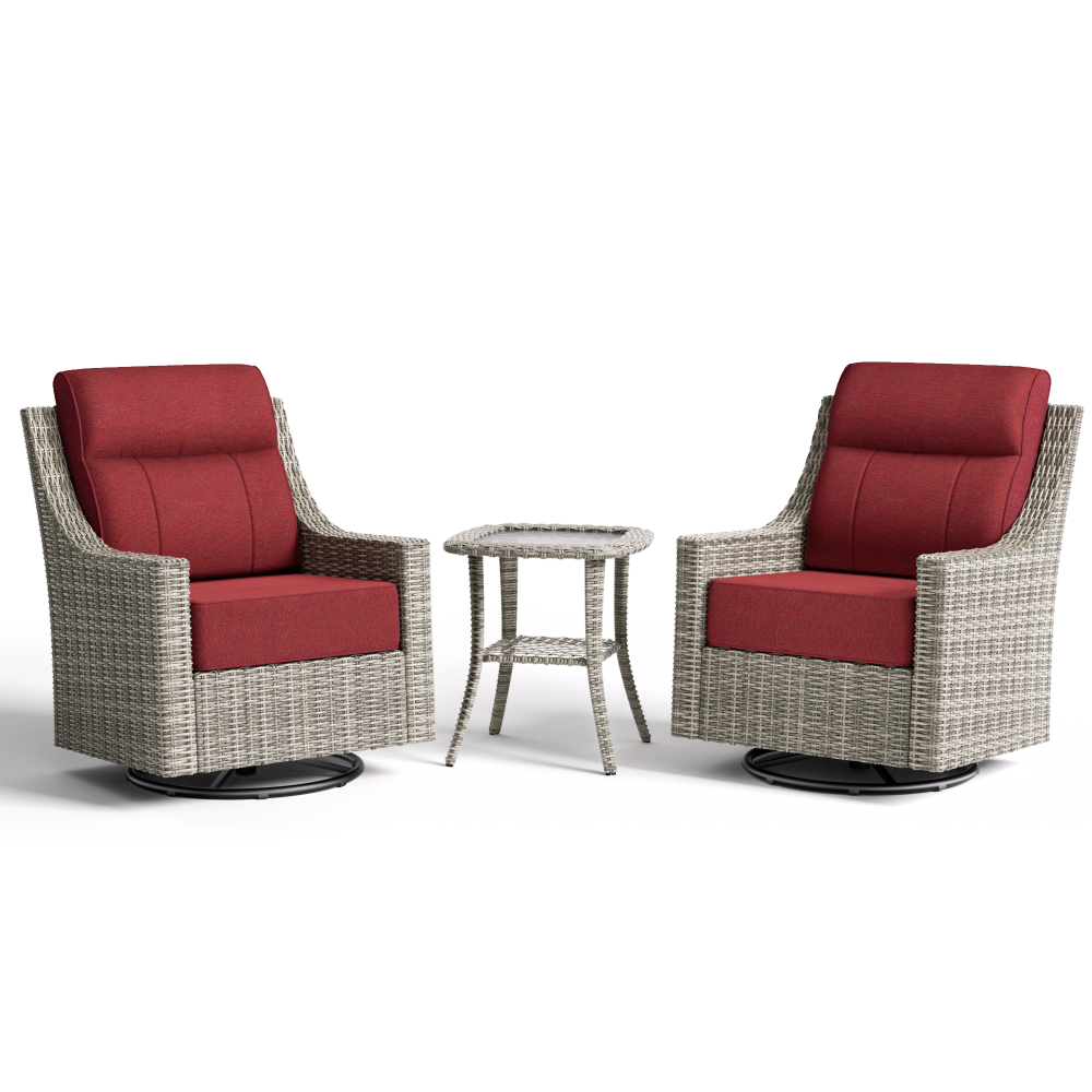 Two wicker chairs with red cushions and a matching side table on a white background